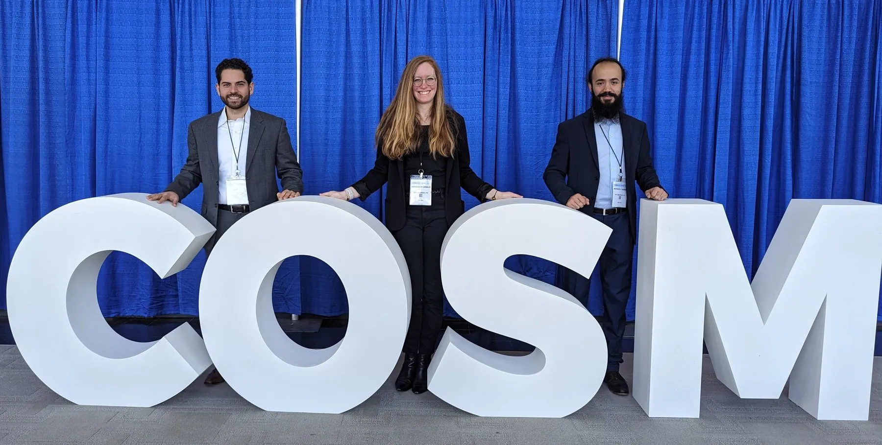 Jay Reddy, Hannah Mormer, and Mohsen Tabrizi at COSM 2023 in Boston: standing behind the COSM letters at the Combined Otolaryngology Spring Meetings, which hosted the ANS annual meeting.