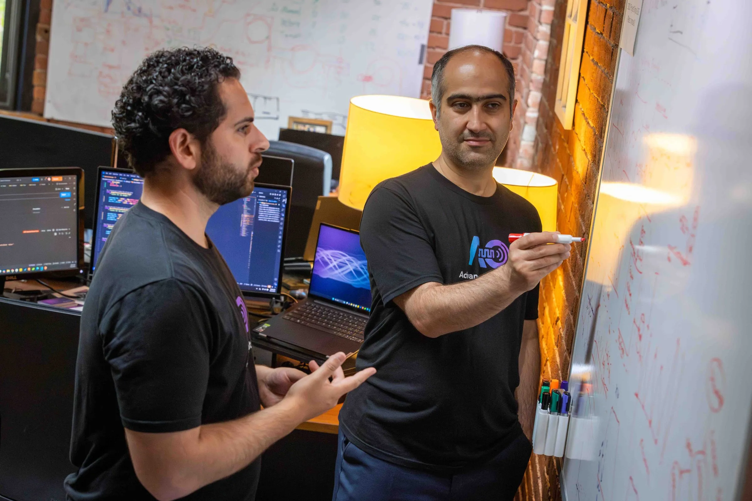 Jay Reddy and Maysam Chamanzar in the office, in the photograph The Link ran with the story.